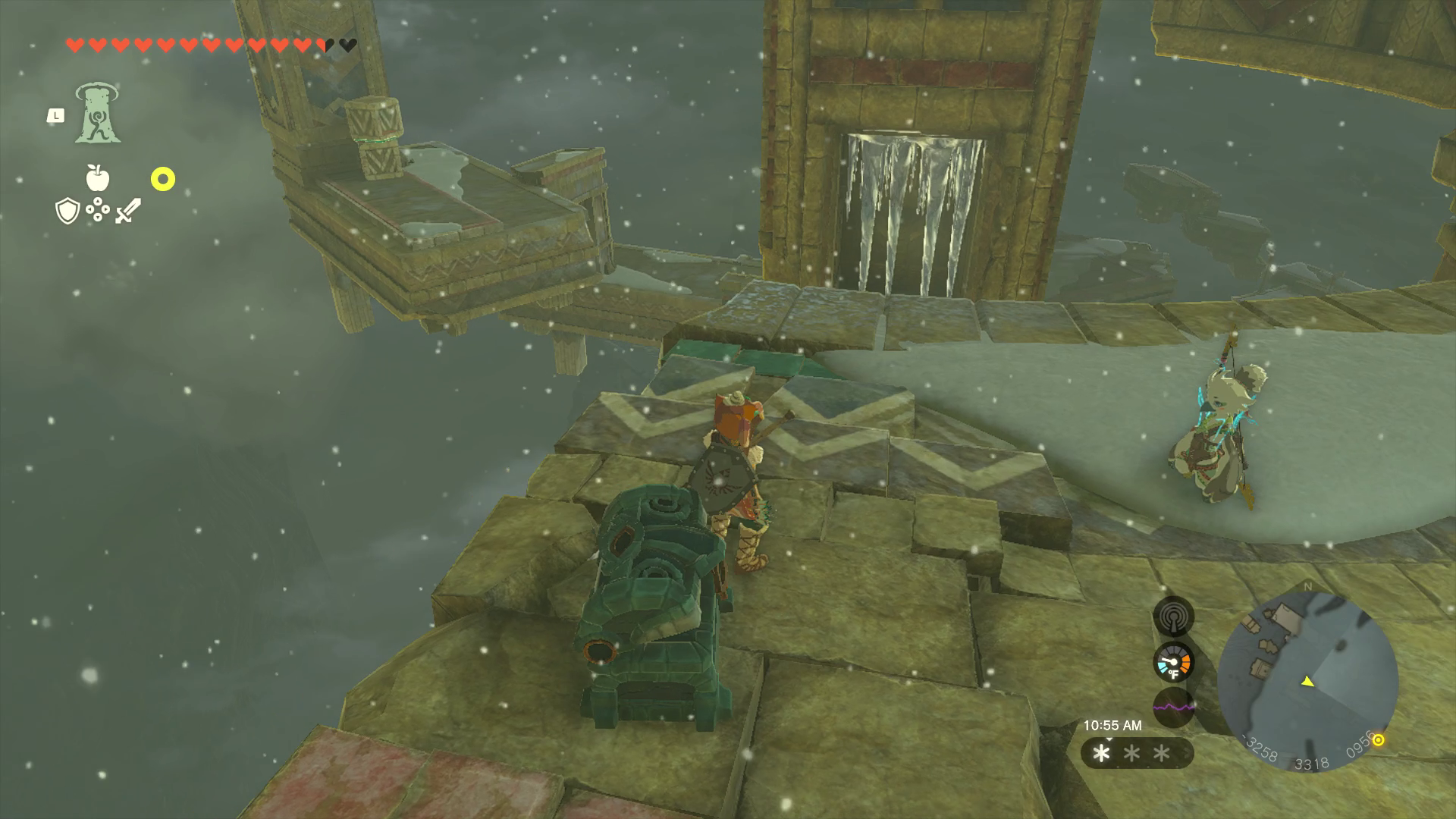 Link stands directly in front of an opened treasure chest, facing a pillar with a door opening blocked by icicles.