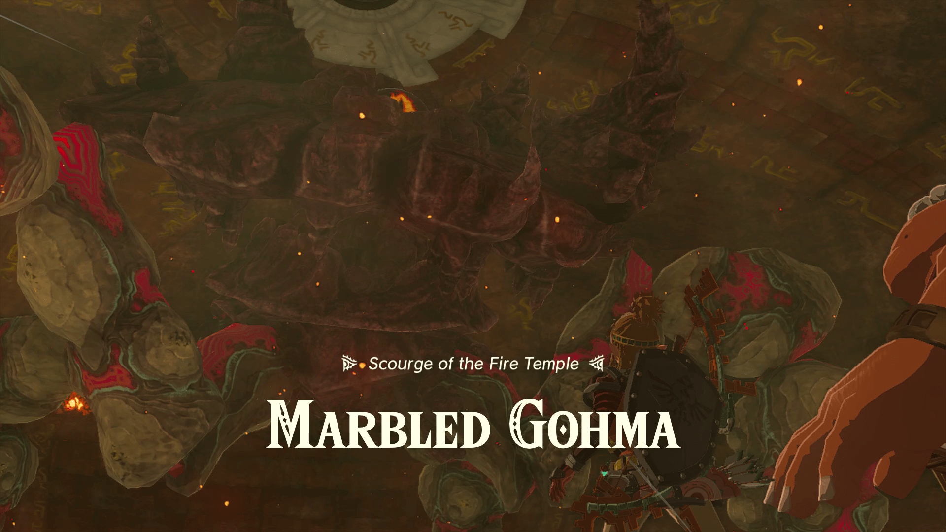The boss introduction screen for Scourge of the Fire Temple, Marbled Gohma, in Tears of the Kingdom. The boss is a crab made out of many rocks with one large eye in the center.