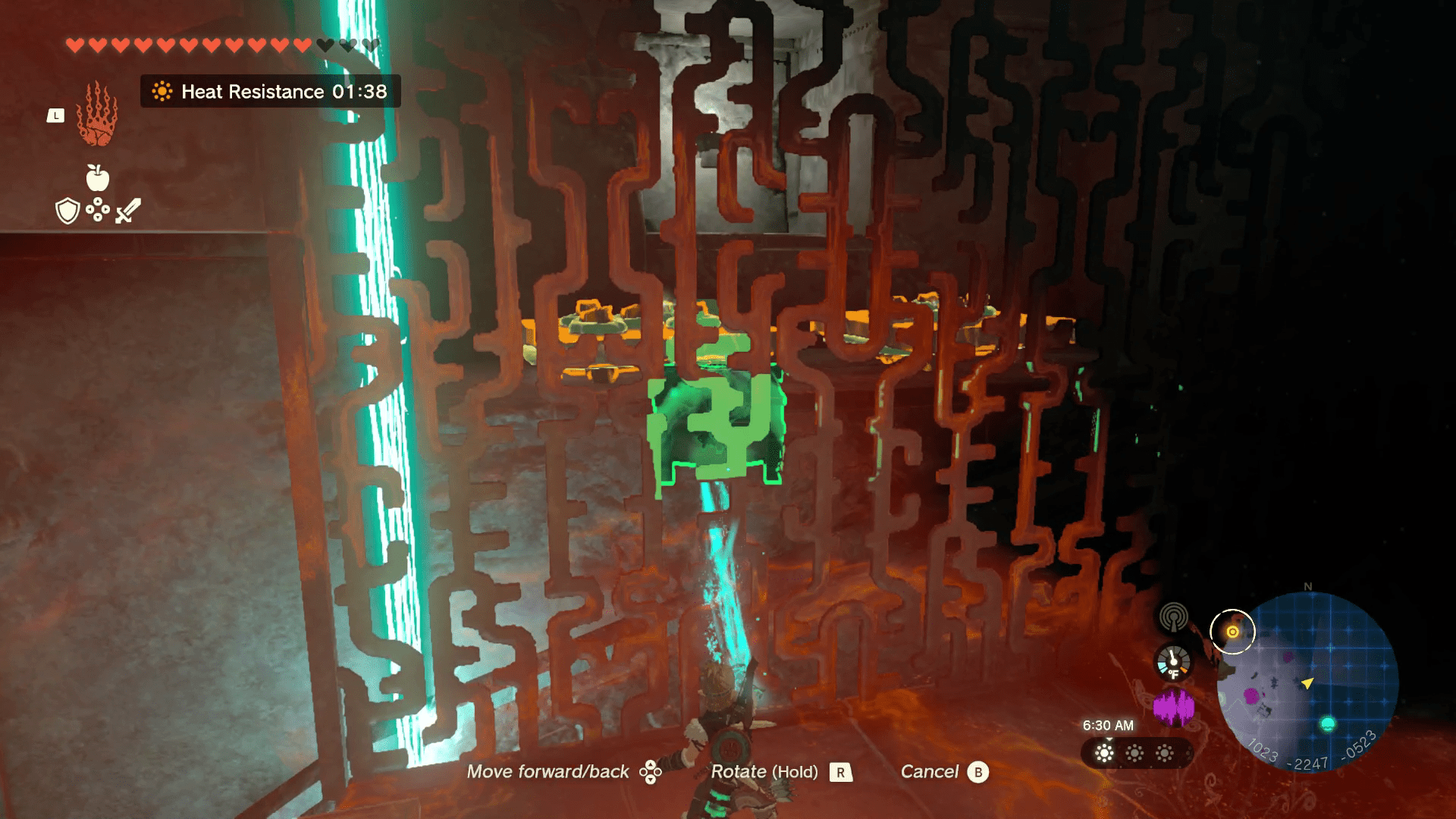 Link picks up a treasure chest through a metal grate using his Ultrahand ability in Tears of the Kingdom