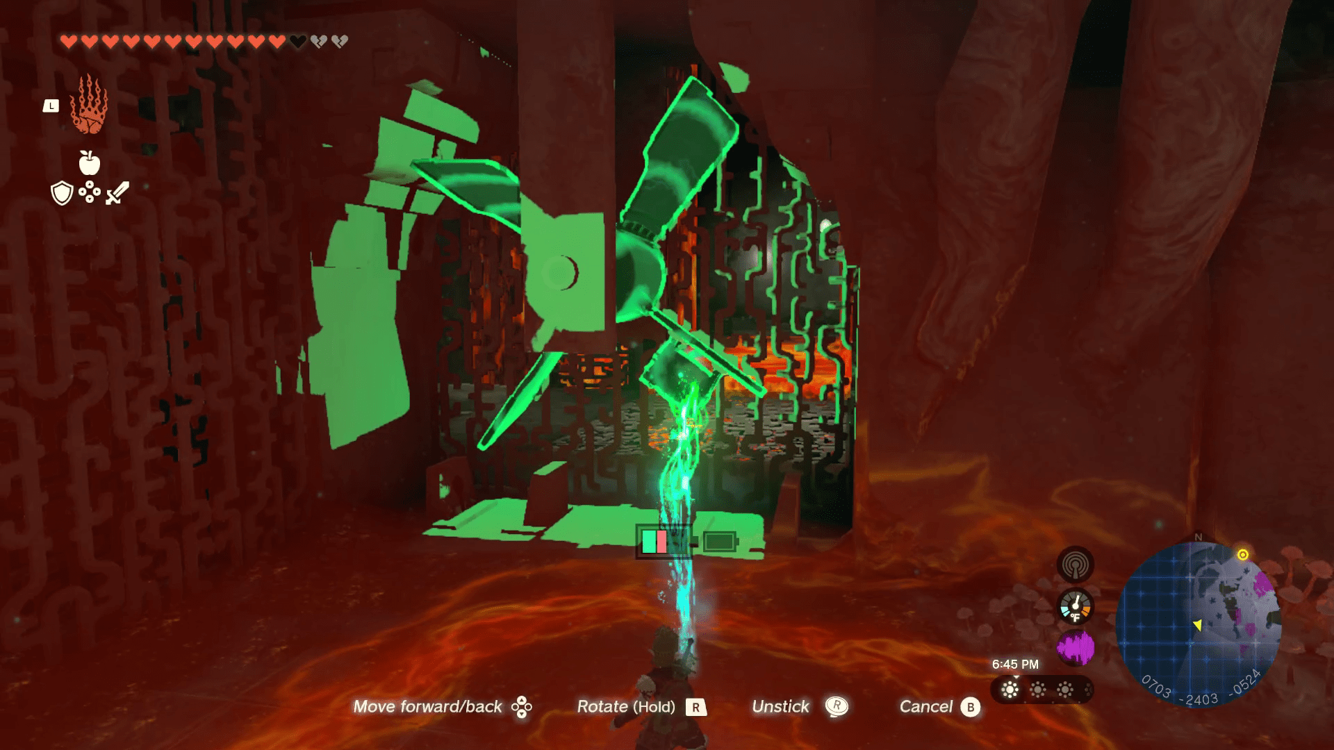 Link uses Ultrahand to pull a chest off of a spinning wheel in the corner of a dark room in Tears of the Kingdom