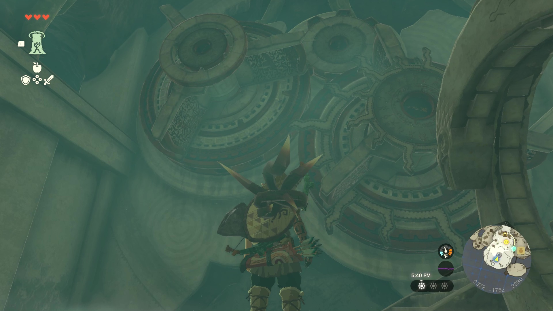 Link looking at cogs in the Room of Awakening