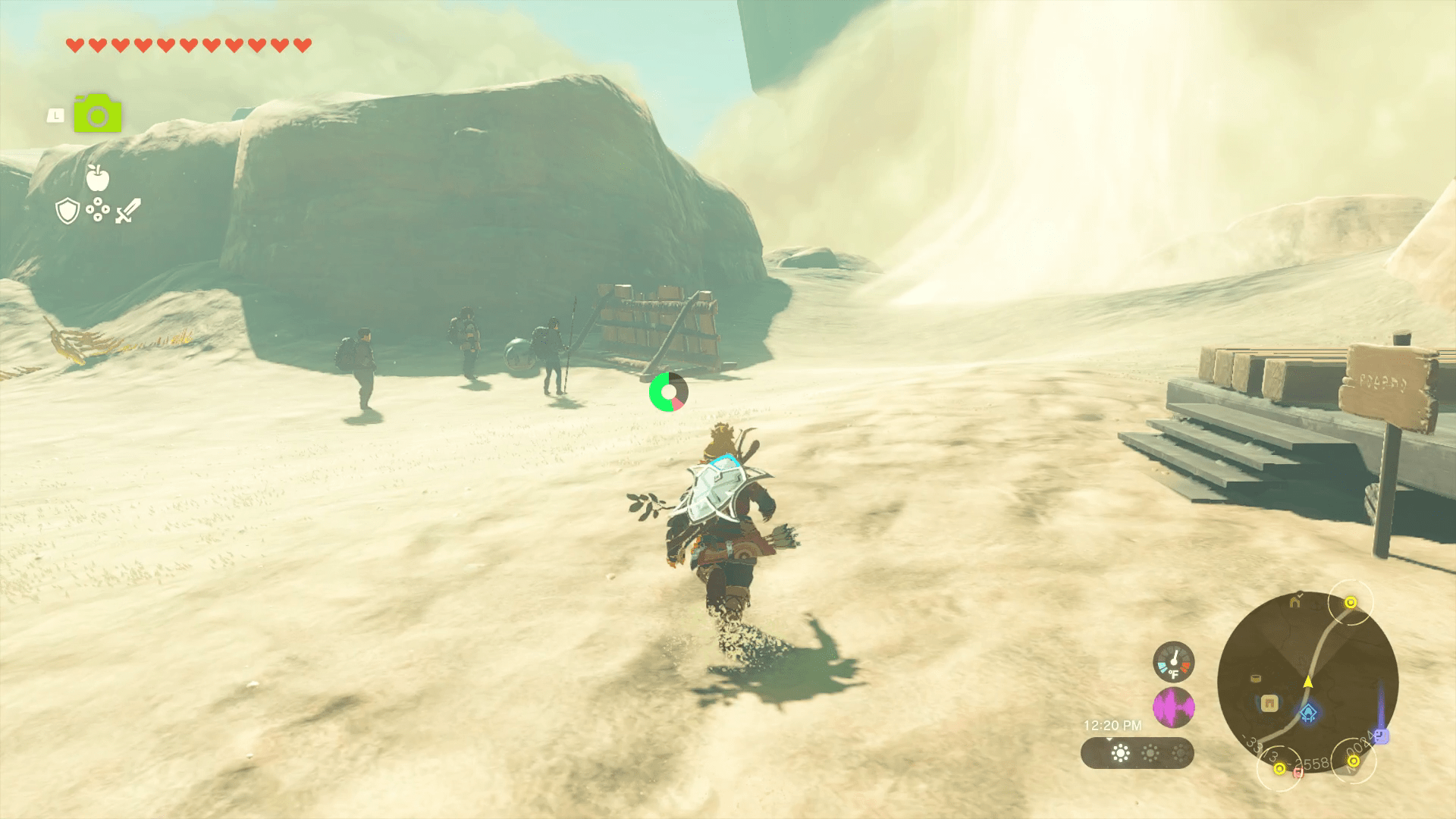Link runs forward outside of Kara-Kara Bazaar, towards an updraft of sandy wind surrounded by some cautious travelers in Tears of the Kingdom.