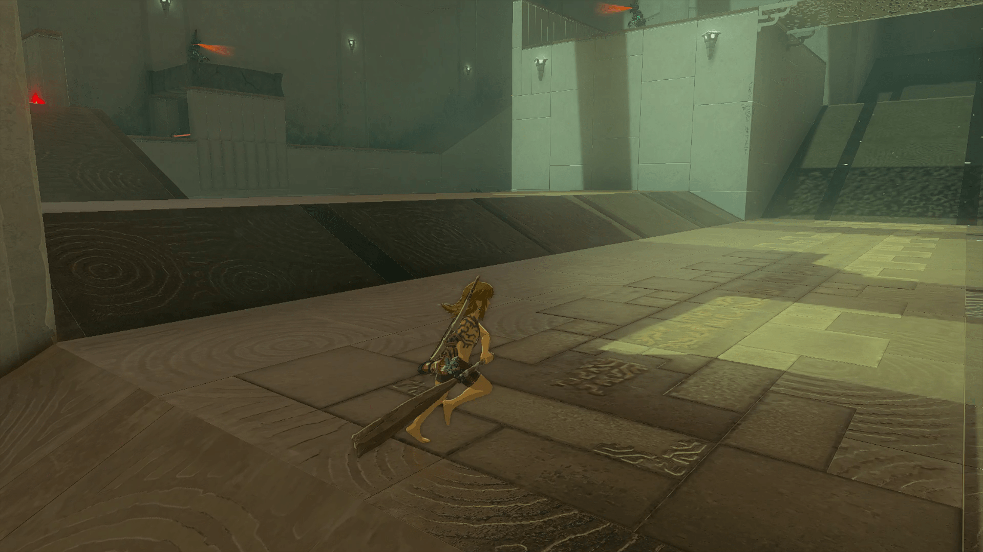 Holding a Thick Stick at his side, Link runs into the largest chamber of Miryotanog Shrine, which is full of ramps, platforms, and bridges patrolled by Constructs