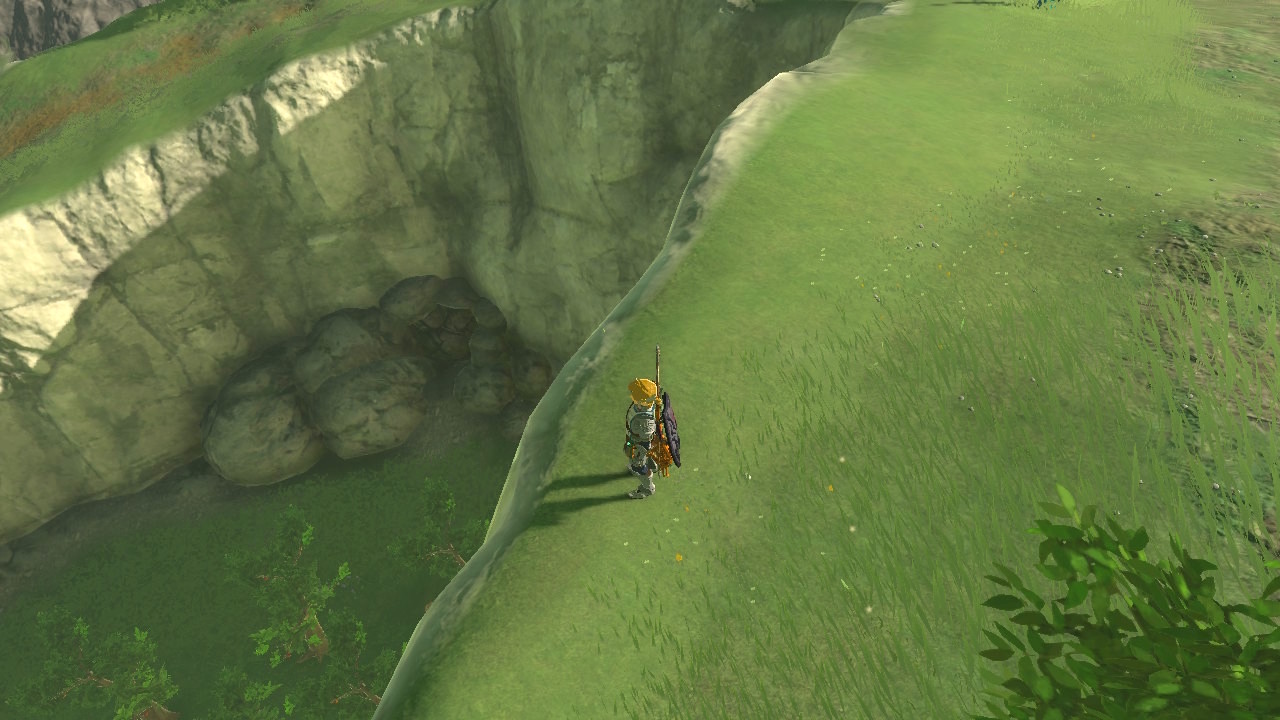 Link standing near rocks next to Hateno Village Research Lab in Zelda: Tears of the Kingdom