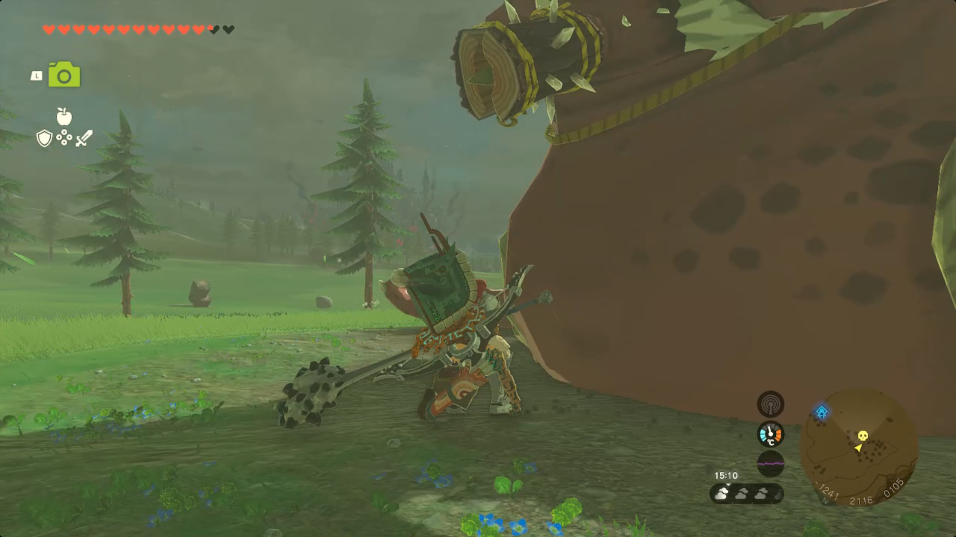 Link sneaks up on a sleeping Hinox in a field in Zelda Tears of the Kingdom.