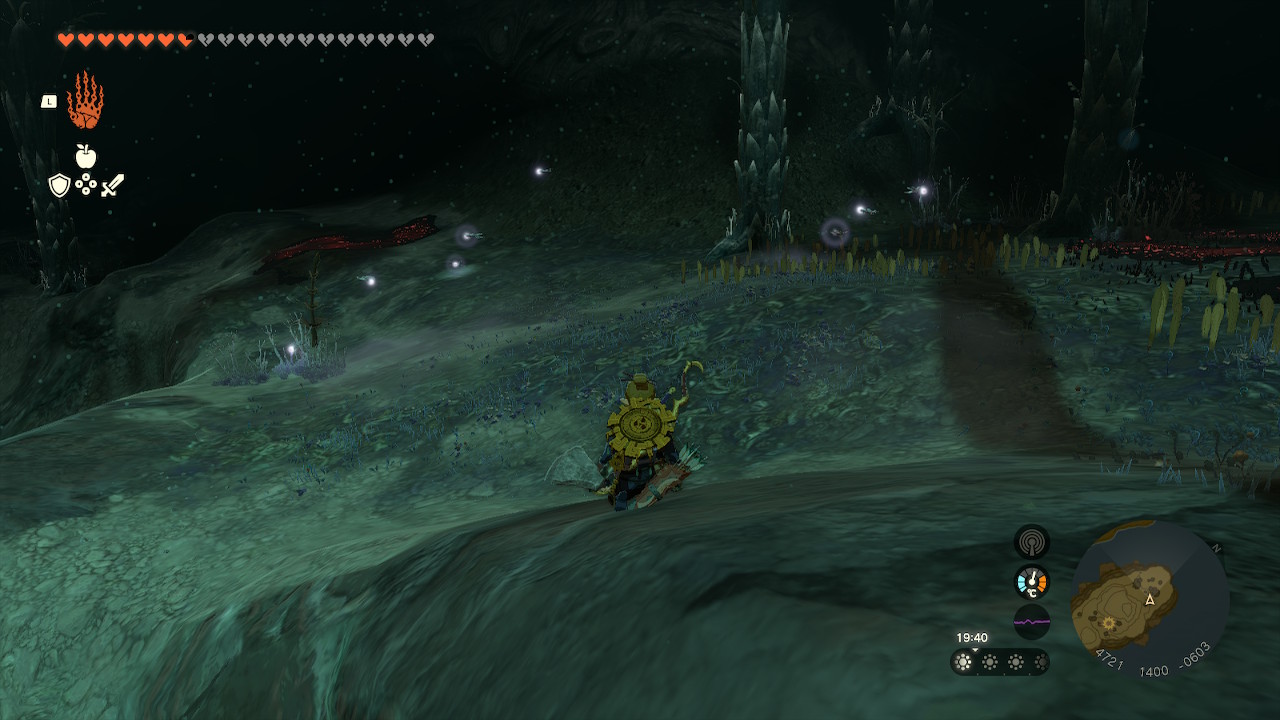 Link crouches while looking for fireflies in the Depths in Zelda Tears of the Kingdom.